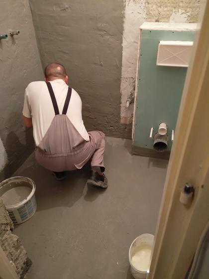 Applying the waterproofing.