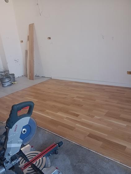 The corner of the room, the boards cut to size right up to the wall
